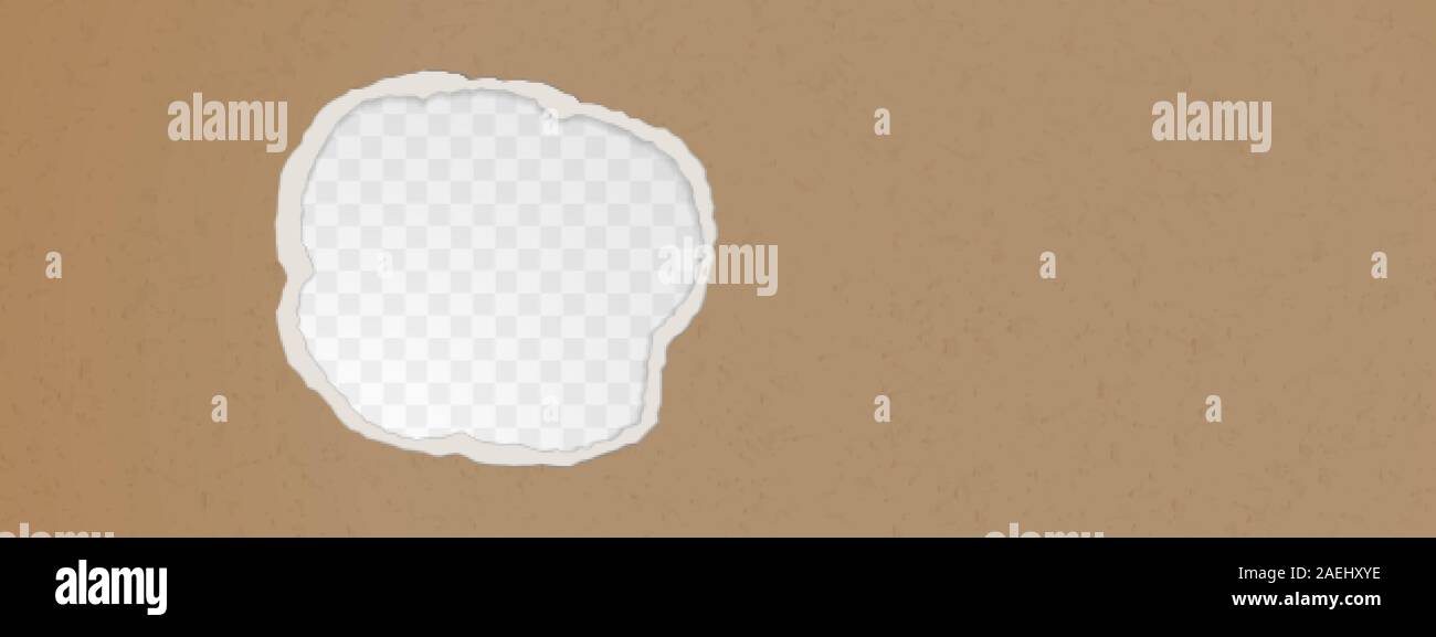 A hole in the ripped recycled paper background. Cardboard or paperboard ...
