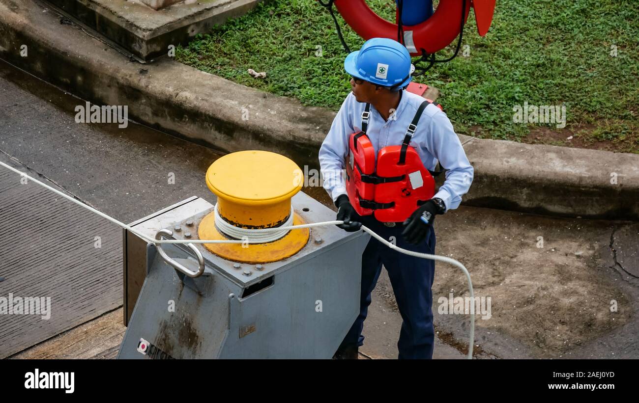 Close up of a Panamanian man working at the locks of Panama Canal. Stock Photo