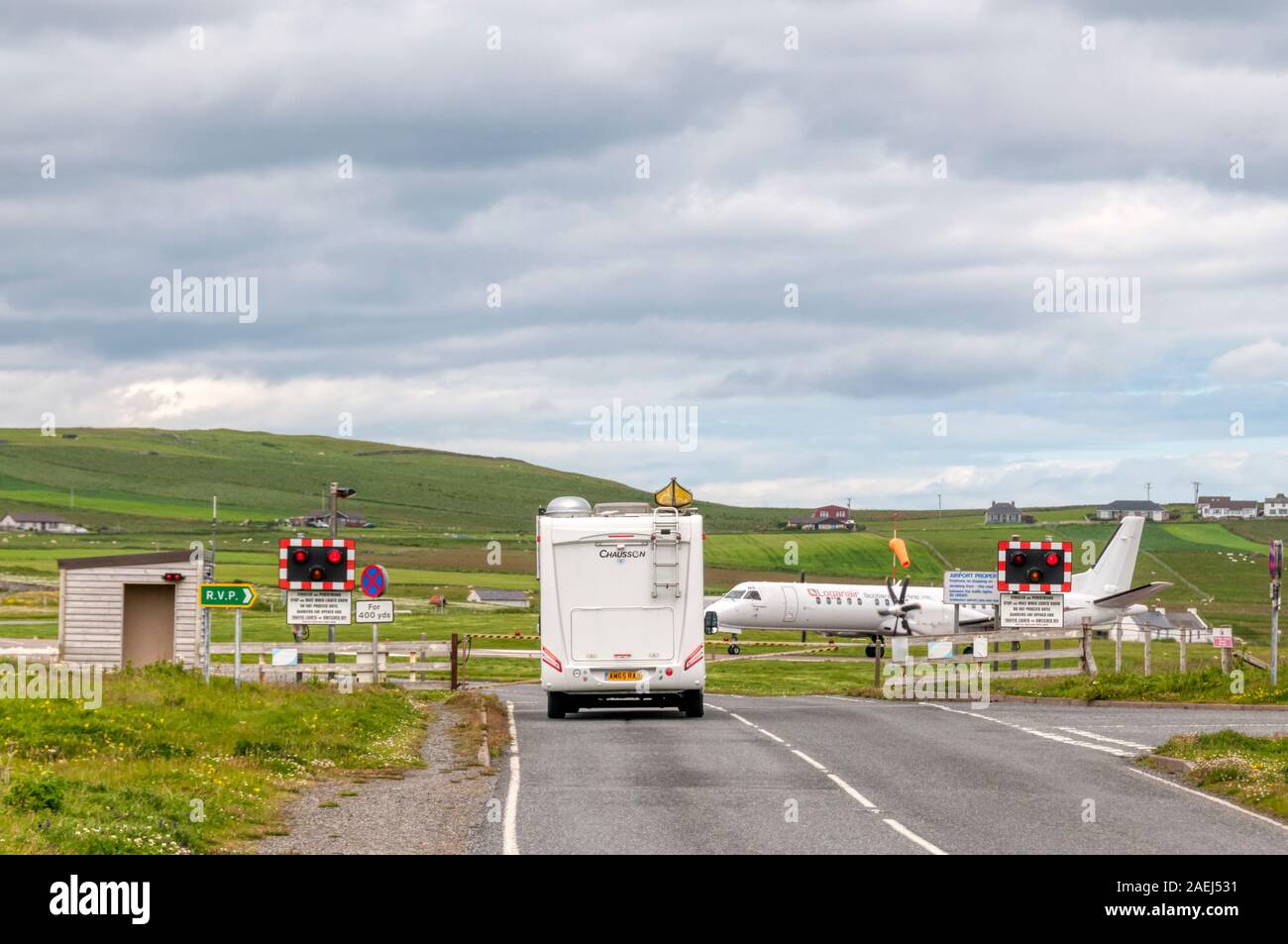 Road closed for taxiing aircraft at Sumburgh Airport, Shetland. Stock Photo