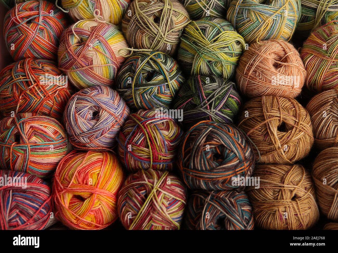 Knittind needles. Colorful balls of yarn and wooden needles isolated on ...
