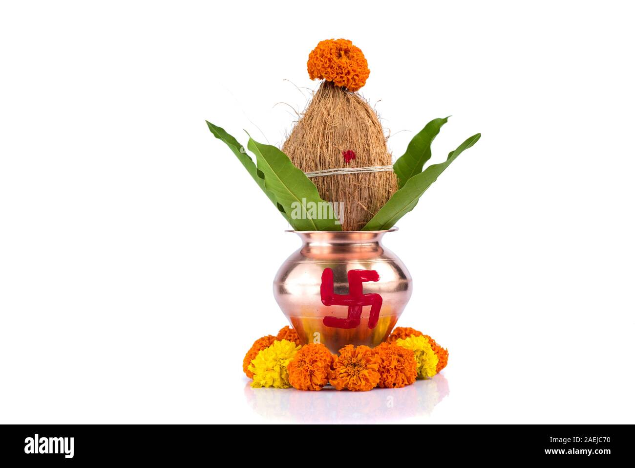 Copper Kalash with coconut and mango leaf with floral decoration on a