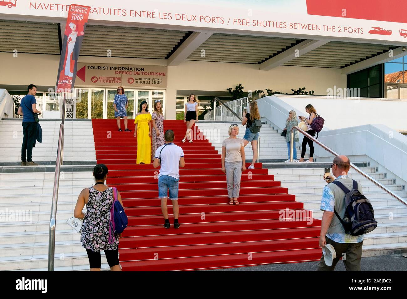 Tourists posing on the red carpet, Palais des Festivals, Boulevard de la Croisette, Cannes, Provence, France, Europe Stock Photo