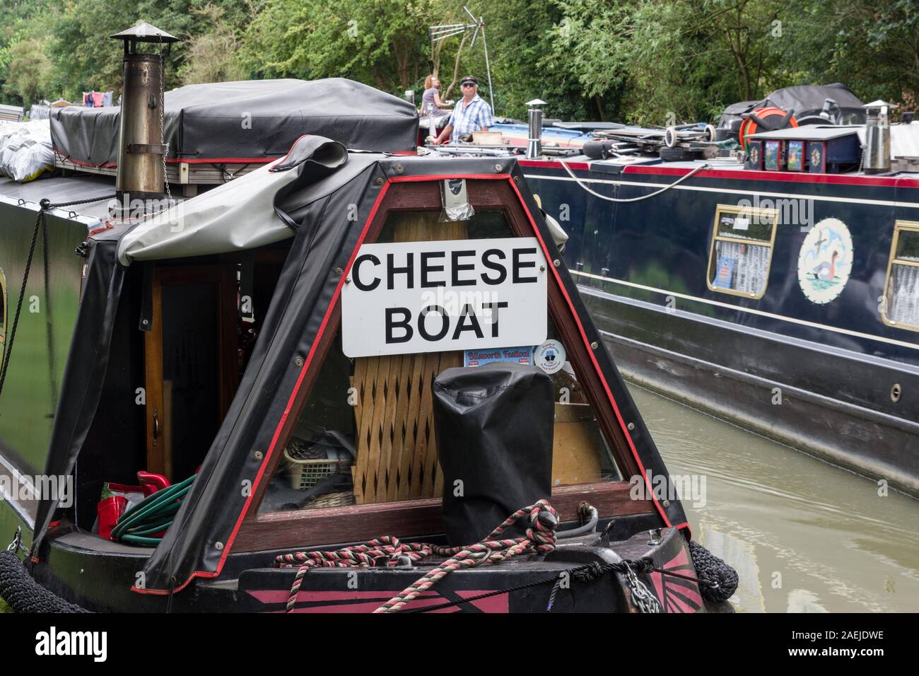 The Cheese Boat, a commercial narrowboat, moored on the Grand Union canal at Cosgrove, Northamptonshire, UK Stock Photo