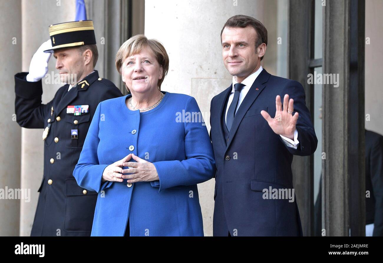 Paris, France. 09th Dec, 2019. French President Emmanuel Macron welcomes German Chancellor Angela Merkel to the Elysee Palace December 9, 2019 in Paris, France. Merkel is in Paris for the Normandy Format Summit in an effort to find an end to the war in Ukraine. Credit: Alexei Nikolsky/Kremlin Pool/Alamy Live News Stock Photo