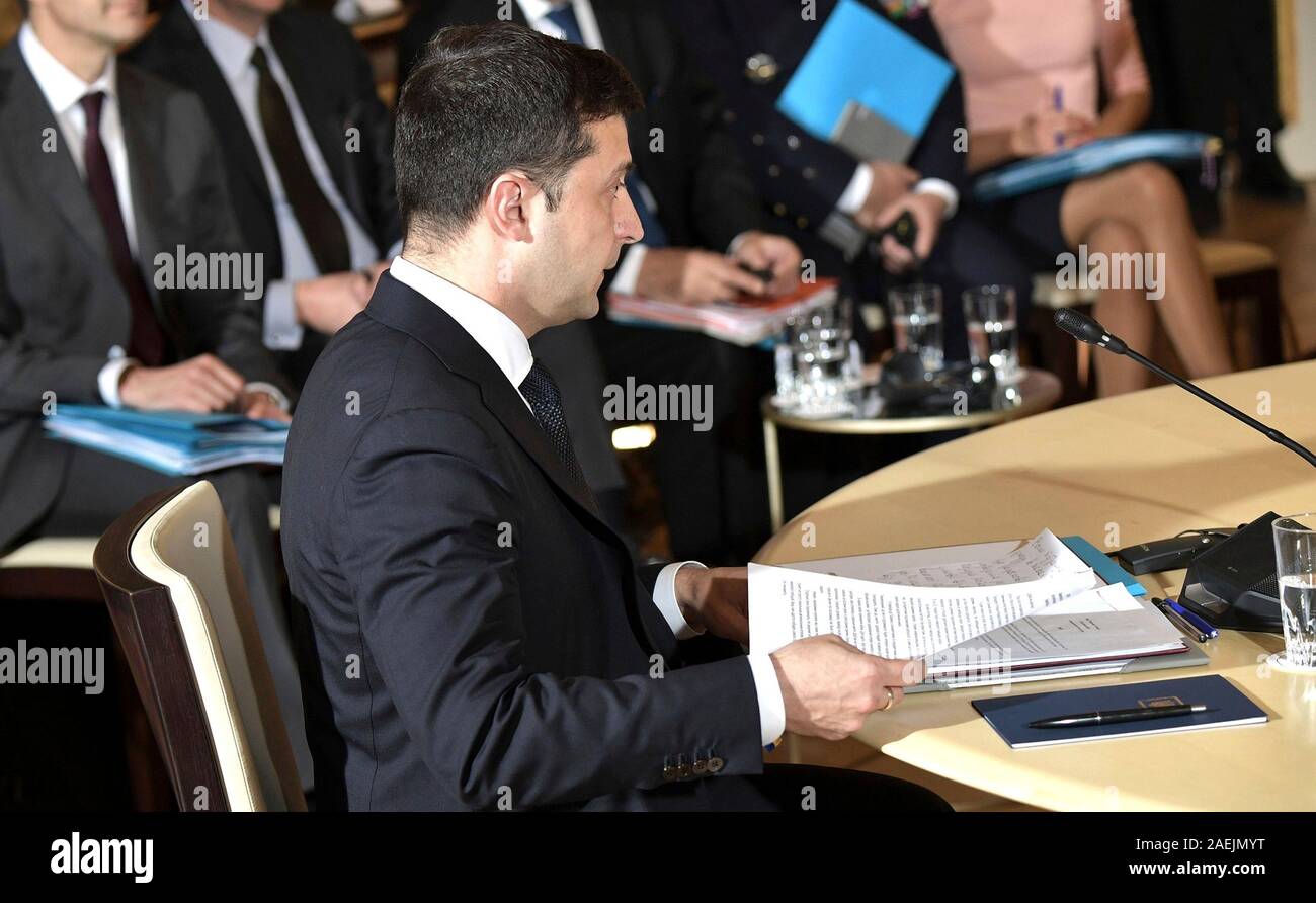 Paris, France. 09th Dec, 2019. Ukrainian President Vladimir Zelensky prepares for the start of the Normandy Format Summit meeting at the Elysee Palace December 9, 2019 in Paris, France. The summit is attended hosted by French President Emmanuel Macron and German Chancellor Angela Merkel in an effort to find an end to the war in Ukraine. Credit: Alexei Nikolsky/Kremlin Pool/Alamy Live News Stock Photo