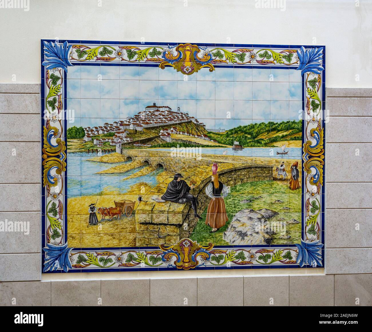 Detail of the beautiful polychromatic ceramic tiles panel depicting the farming life along the river, on a wall in Tentugal, Coimbra, Portugal Stock Photo