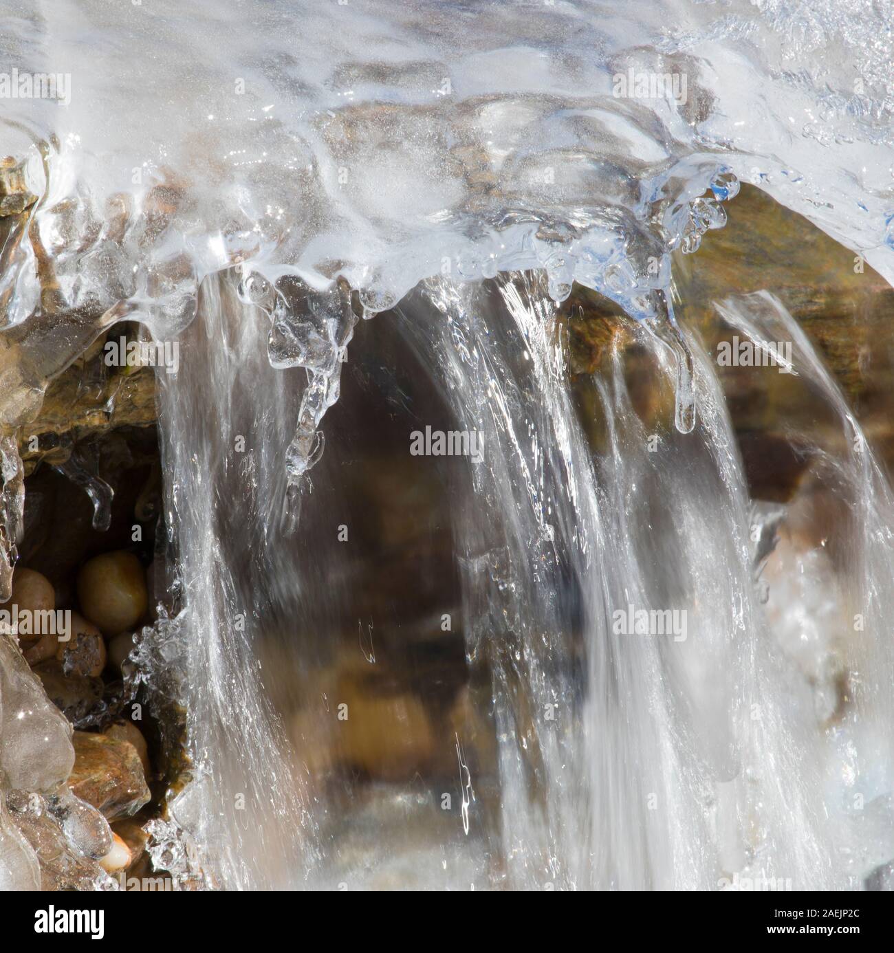 Water flowing under ice formed after the snow bomb cyclone hit North ...