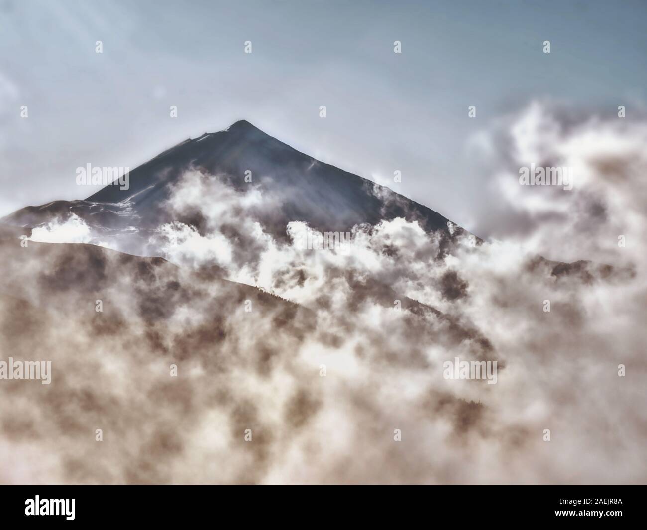 Mystical atmosphere by  rising fog spirit at the foot of the volcano El Teide on Tenerife at 2500 m altitude, Stock Photo
