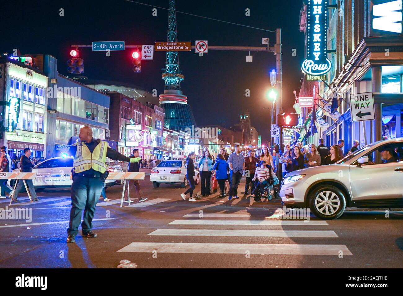 People enjoy Broadway by night in Nashville. This historic street in