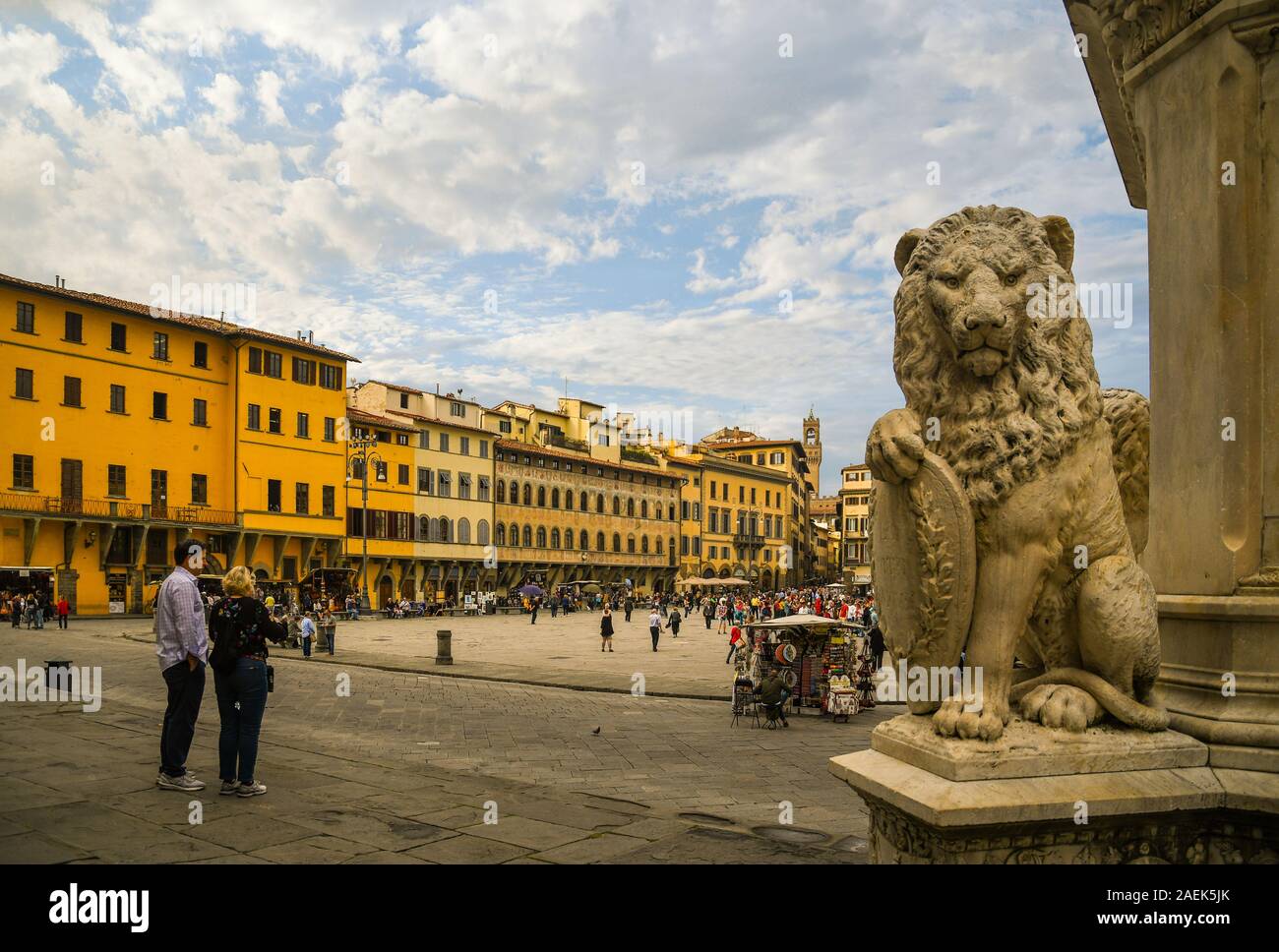 View of Santa Croce Square in the historic centre of Florence with a lion statue on the base of the Monument to Dante Alighieri, Tuscany, Italy Stock Photo