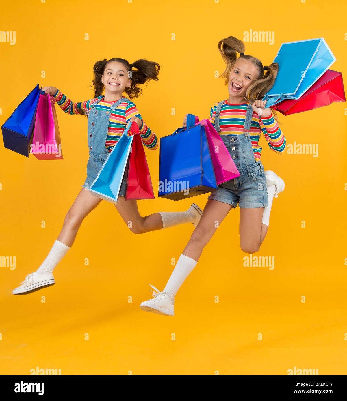 Happy children. Little girls with gifts. Summer shopping. Total sale. Kids fashion. Holiday purchase saving. Home shopping. Buyer consumer concept. Small girls with shopping bags. Sales and discounts ...