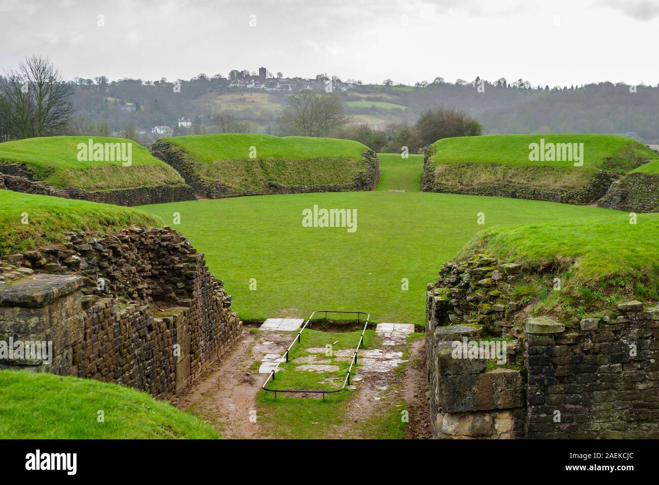 Grass covered remains of the ancient Roman amphitheatre at Caerleon Roman Fortress, Isca, near Newport, Gwent, south Wales Stock Photo