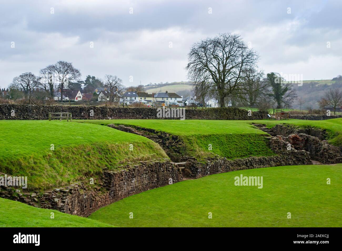 Grass covered remains of the ancient Roman amphitheatre at Caerleon Roman Fortress, Isca, near Newport, Gwent, south Wales Stock Photo