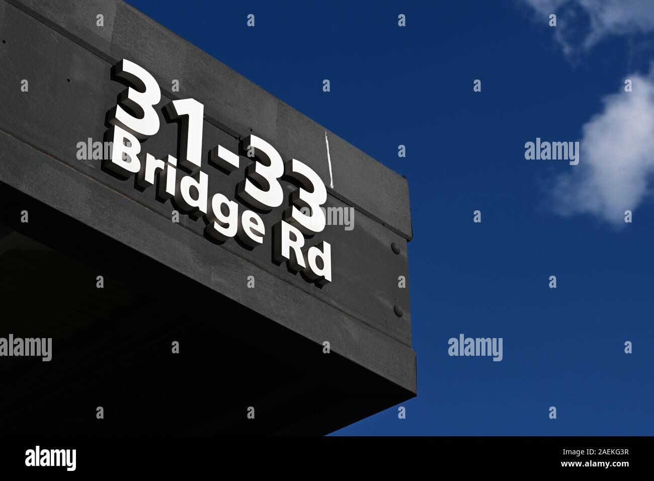 Low angle looking up at shop address on verandah of 31-33 Bridge Road, Richmond, Victoria, Australia. Stock Photo