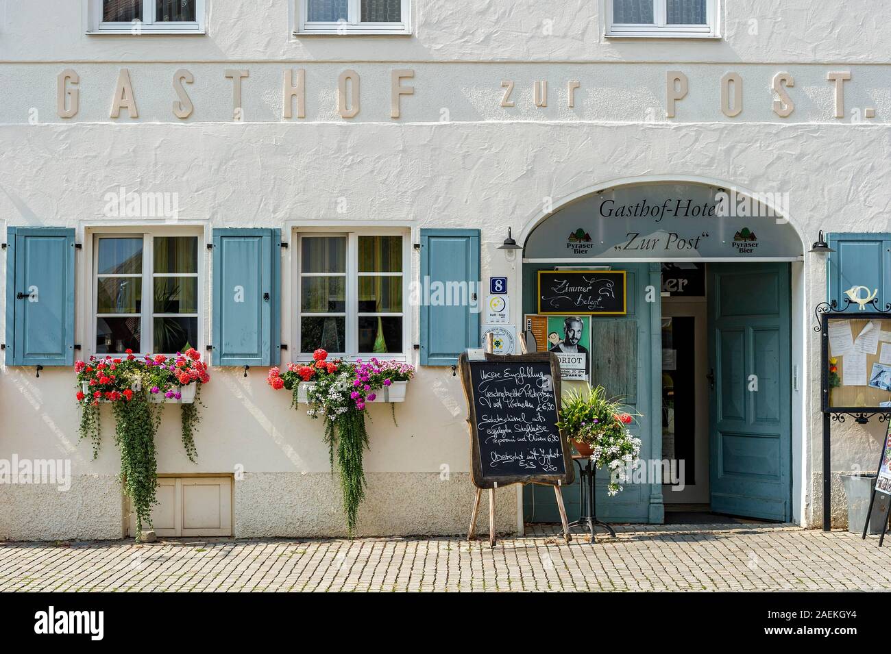 Entrance to the restaurant with menu and flower arrangements, Gasthof zur Post, Old Town, Hilpoltstein, Middle Franconia, Franconia, Bavaria, Germany Stock Photo
