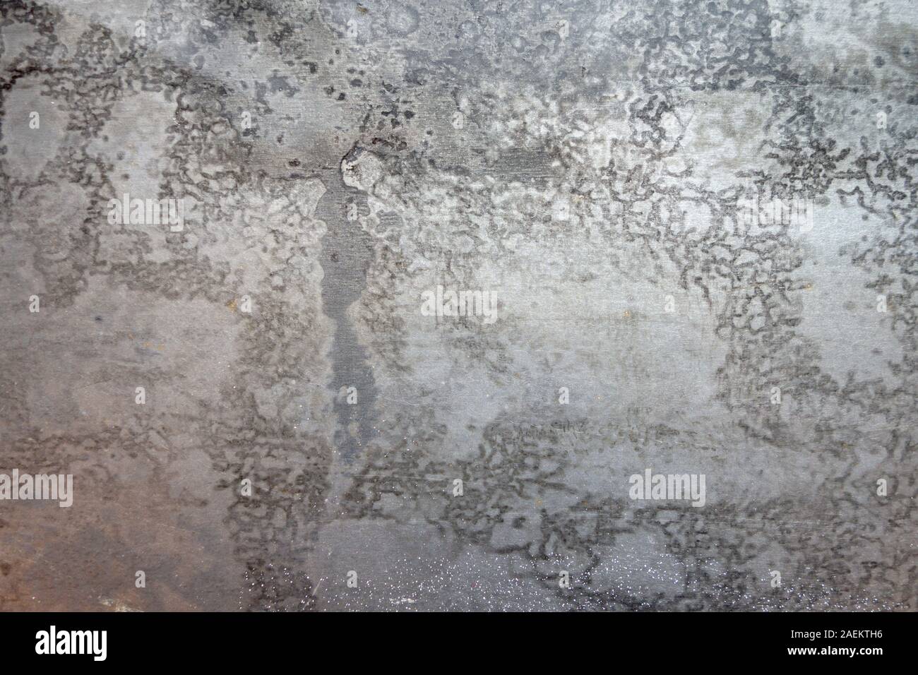 rushed stainless steel with acid wash markings and stains Stock Photo