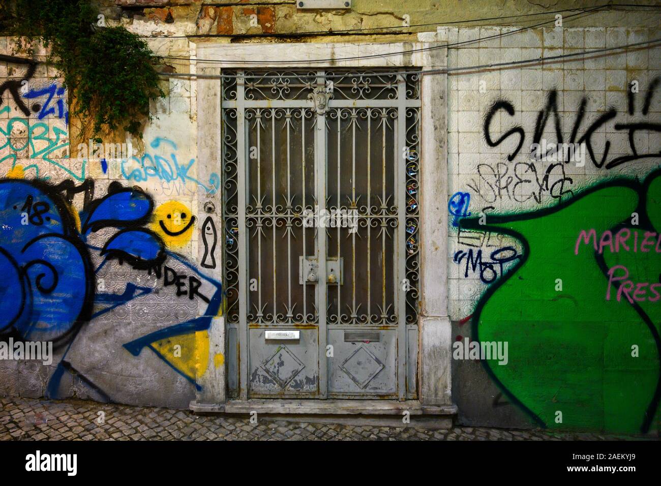 Graffiti on the wall of typical house in Encarnacao, Lisboa Region, Portugal Stock Photo