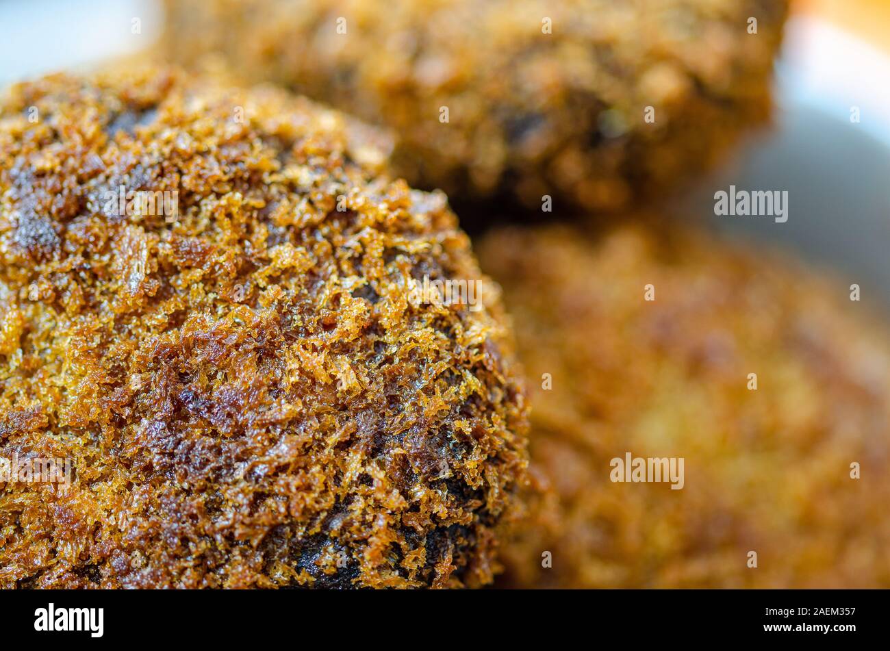 Extreme close-up of a very delicious beef cutlet with more cutlets in the background Stock Photo