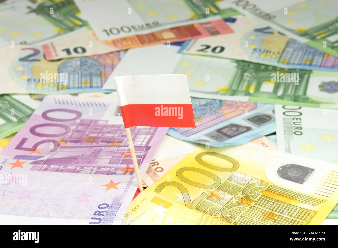 Euro bills and flag of Poland Stock Photo