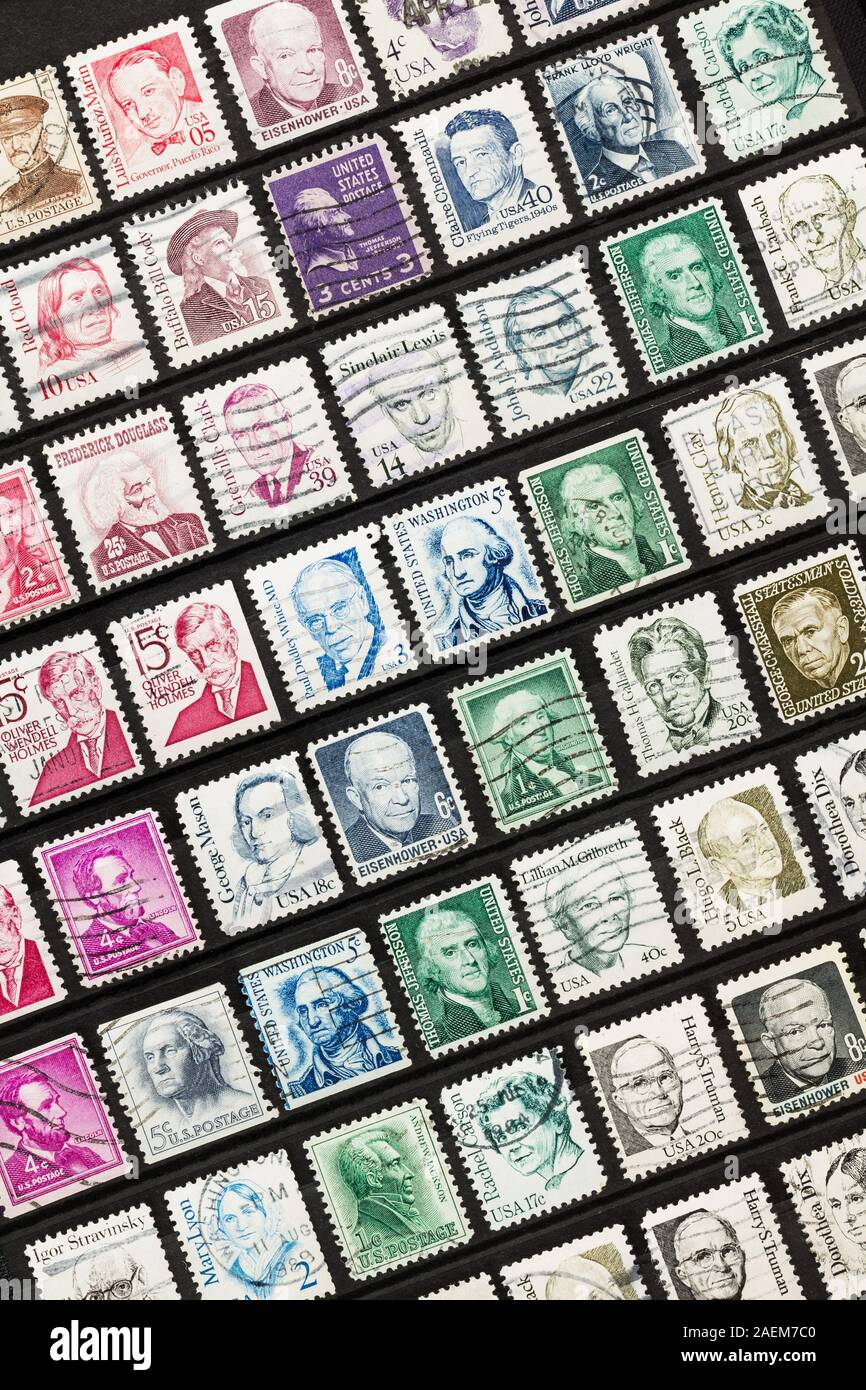 SEATTLE WASHINGTON - December 5, 2019:  Rows of used United States stamps on angle in stock book. Postage featuring portraits of famous Americans. Stock Photo