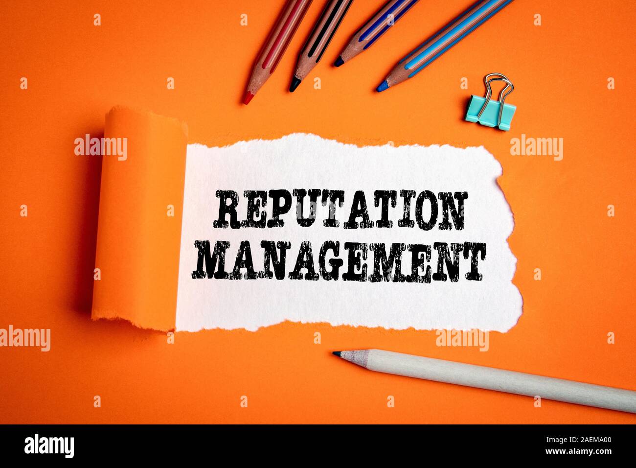 Reputation Management. Trust, brand and marketing. Text under torn paper Stock Photo