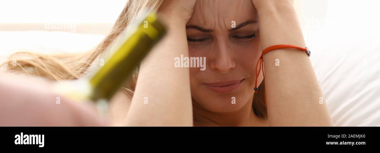 beautiful young blond woman stay in bad Stock Photo