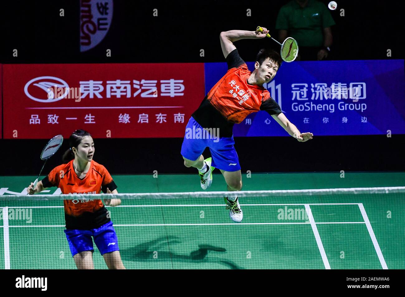 Ren Xiaoyu and Zhou Chaomin of China get the ball against Kouhei Gondou and Ayane Kurihara of Japan at the first round of mixed doubles of Fuzhou Chin Stock Photo