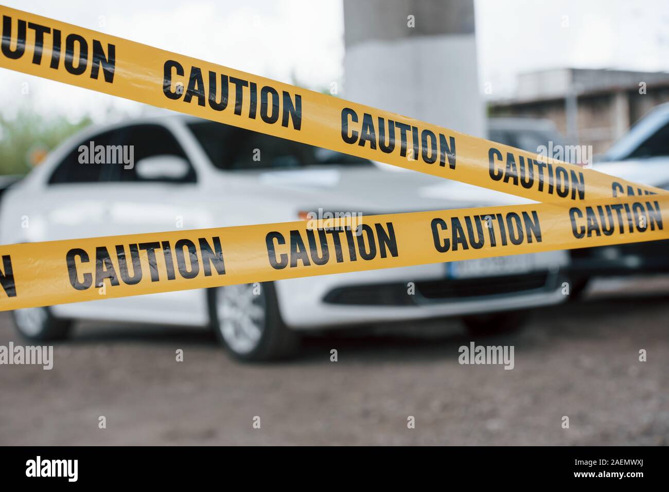 Restricted area. Yellow caution tape near the car parking lot at