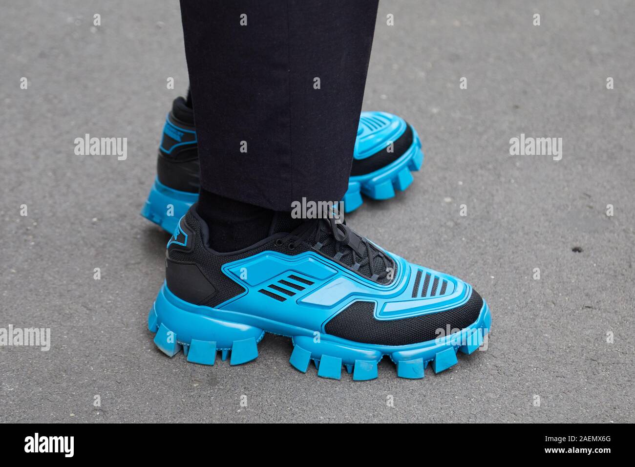 MILAN, ITALY - SEPTEMBER 22, 2019: Man with black and blue Prada Cloudbust  Thunder sneakers before Boss fashion show, Milan Fashion Week street style  Stock Photo - Alamy