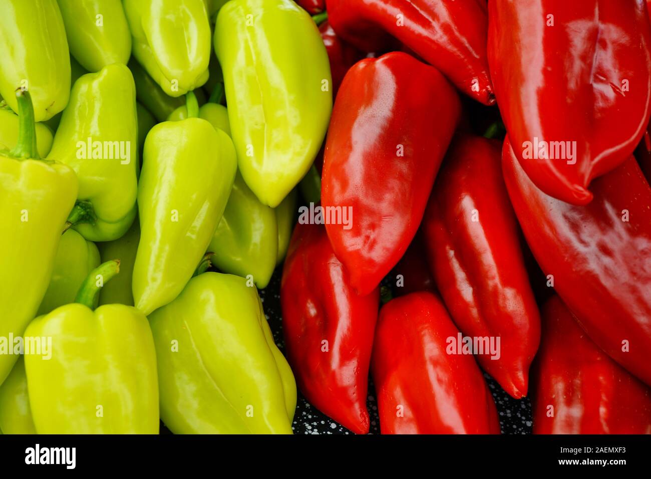 Colorful red and green peppers at a farmers market Stock Photo - Alamy