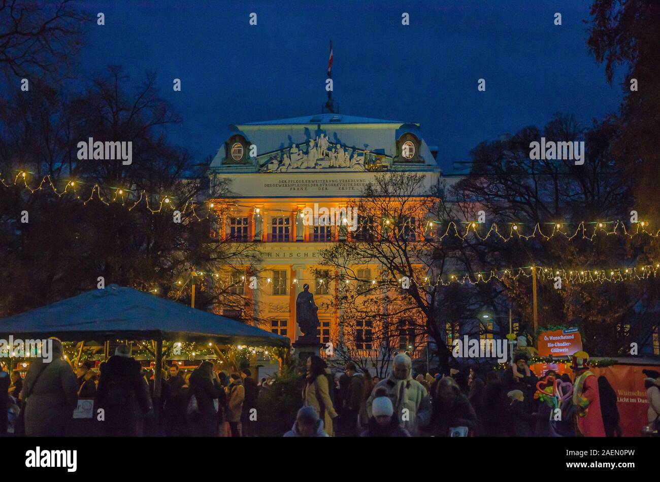 Vienna Christmas markets have great settings. The Karlsplatz version is no exception, nestled in front of Karlskirche and the Technische Universität. Stock Photo
