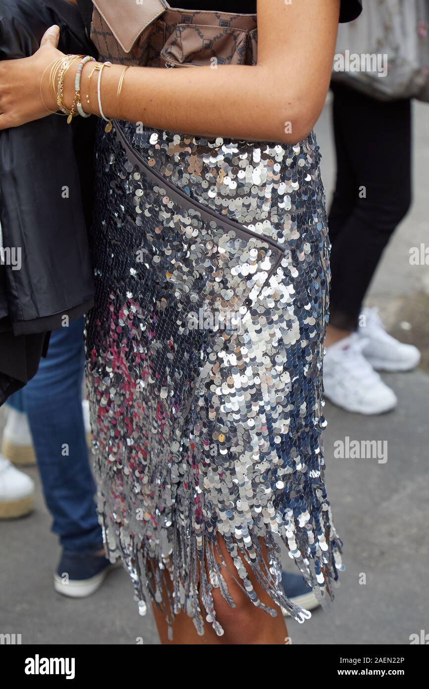 MILAN, ITALY - SEPTEMBER 22, 2019: Woman with silver sequin skirt with  fringes before Fila fashion show, Milan Fashion Week street style Stock  Photo - Alamy
