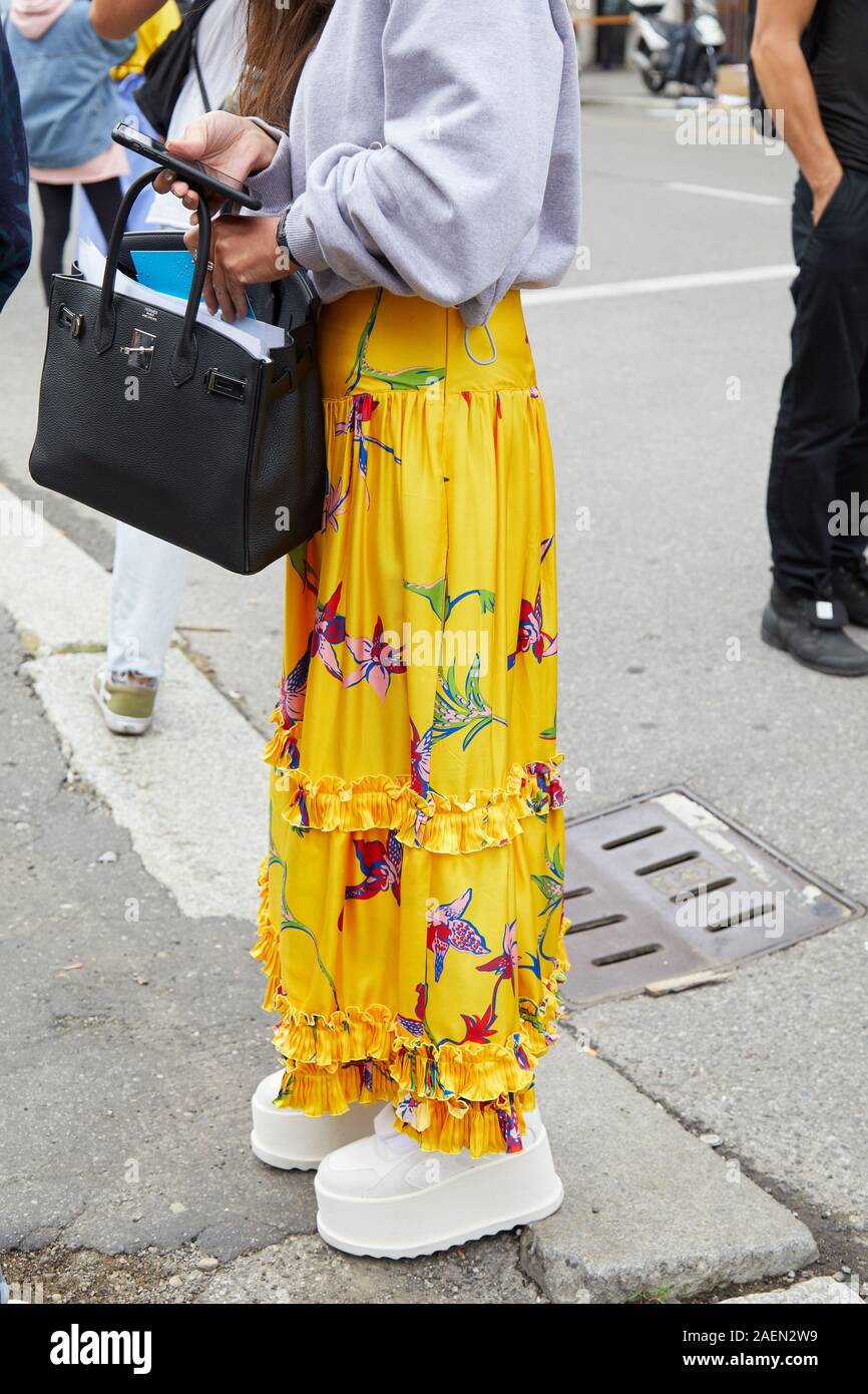 Woman long skirt sneakers hi-res stock and images - Alamy