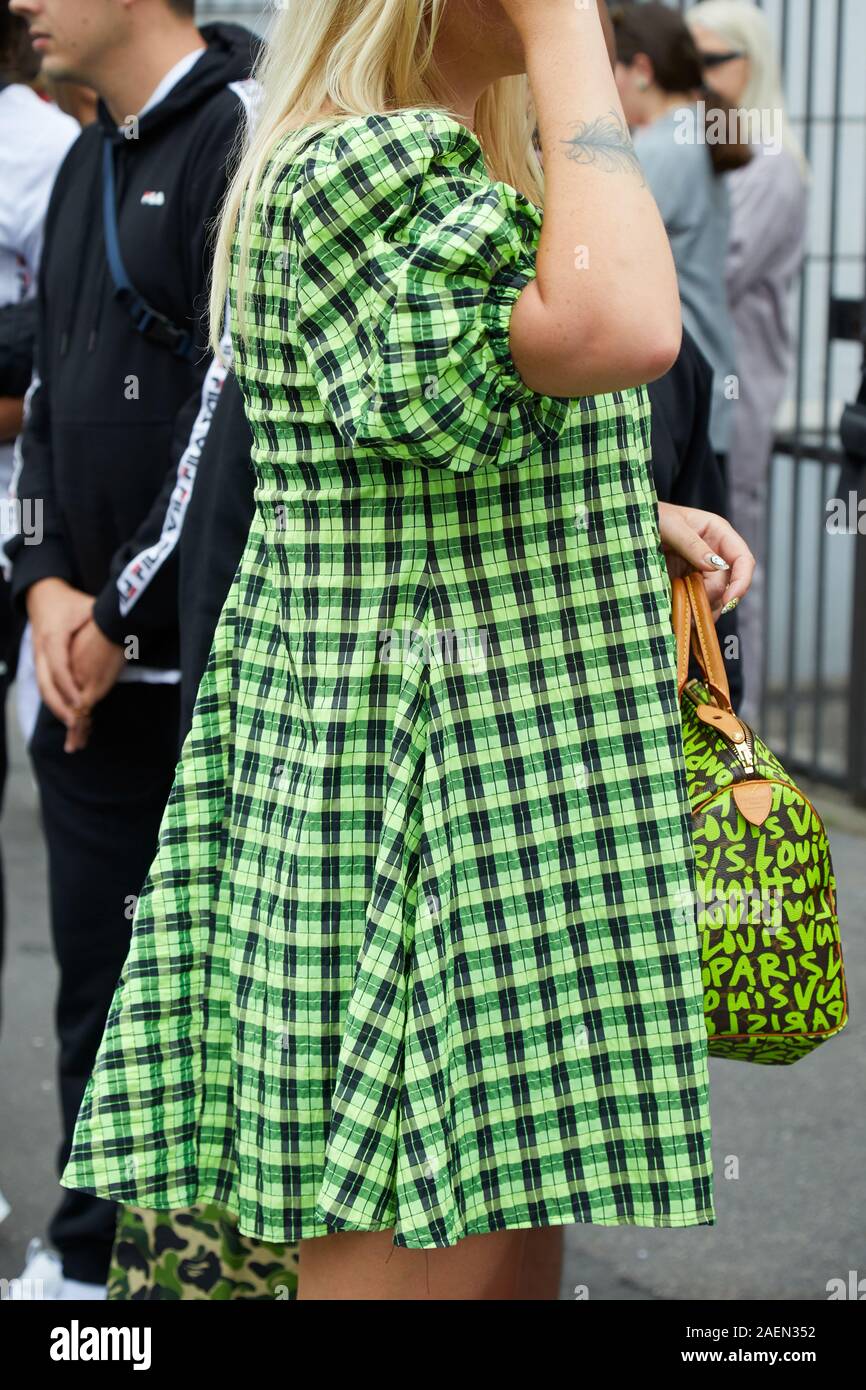 MILAN, ITALY - SEPTEMBER 22, 2019: Woman with green and black