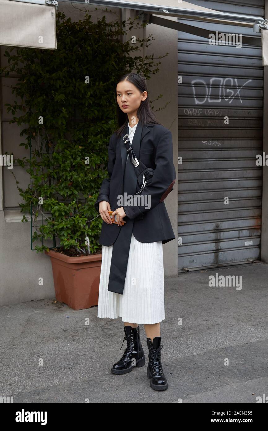 MILAN, ITALY - SEPTEMBER 22, 2019: Top model with black jacket and white skirt after Fila fashion show, Milan Fashion Week street style Stock Photo - Alamy