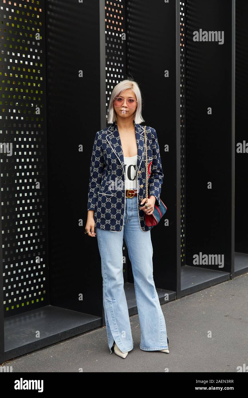 MILAN, ITALY - SEPTEMBER 22, 2019: Woman with denim trousers and Gucci  jacket and shirt before Gucci fashion show, Milan Fashion Week street style  Stock Photo - Alamy