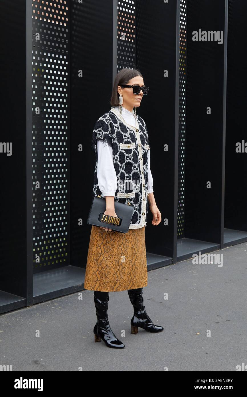 MILAN, ITALY - SEPTEMBER 22, 2019: Woman with Gucci jacket and black patent  leather boots before Gucci fashion show, Milan Fashion Week street style  Stock Photo - Alamy