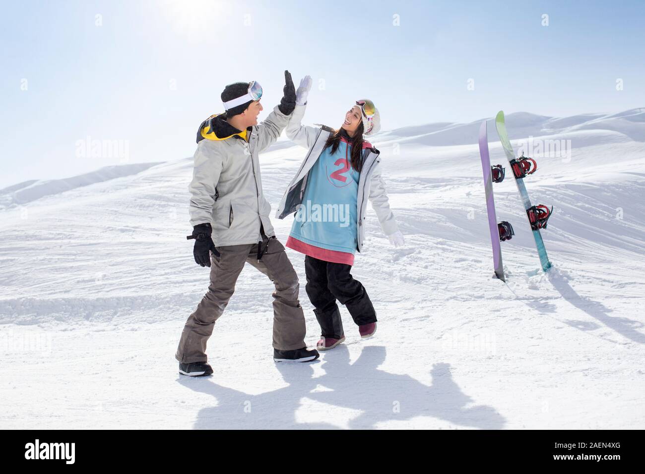 Happy young couple skiing in ski resort Stock Photo