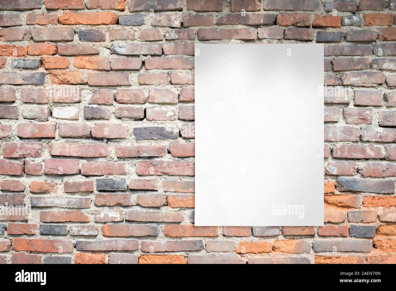 White blank poster template on brick wall. Clean advertising template with copy space beside Stock Photo