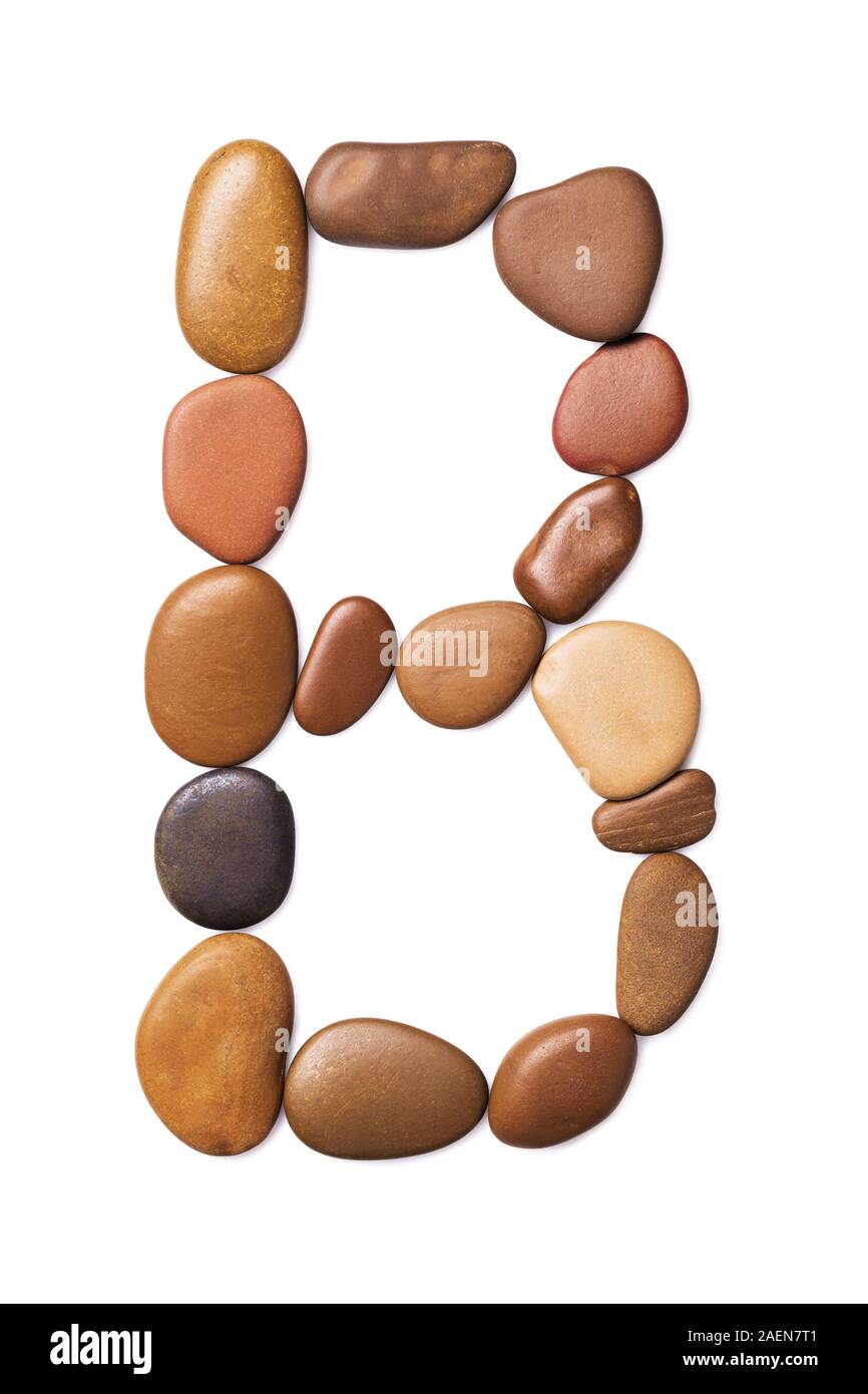 Letter B made of marine small pebbles, top view. Alphabet made of stones Isolated on a white background Stock Photo