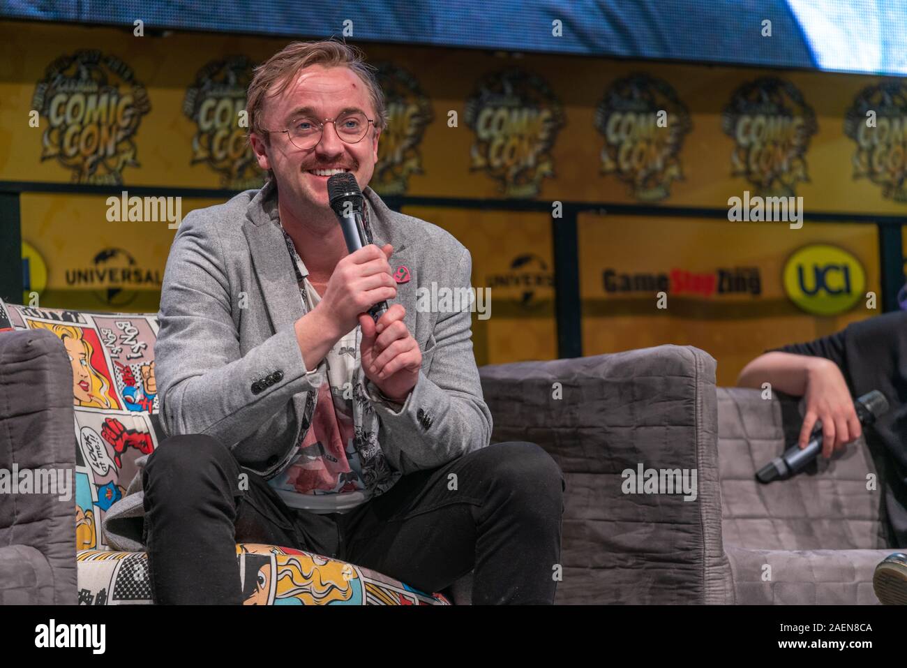 DORTMUND, GERMANY - December 7th 2019: Tom Felton (*1987, English actor and singer - Harry Potter as Draco Malfoy, The Flash, Origin,) talks about his experiences in the movie industry at German Comic Con Dortmund Stock Photo