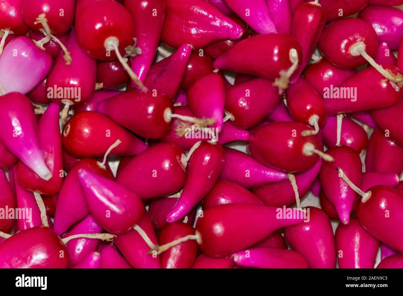 Pitiguey group fresh pink tropical fruit in marketplace Stock Photo
