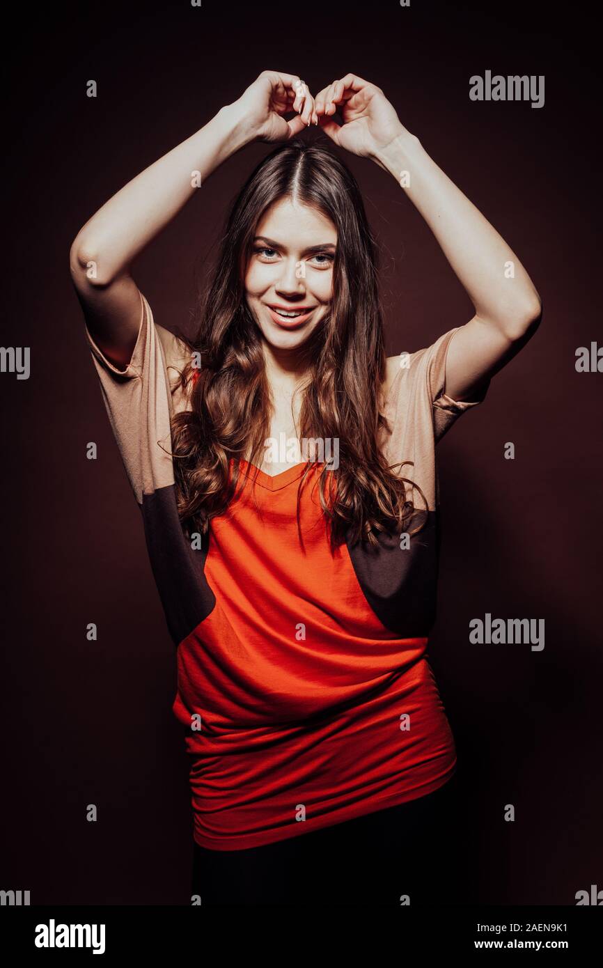 beautiful girl with long hair posing in the Studio Stock Photo - Alamy