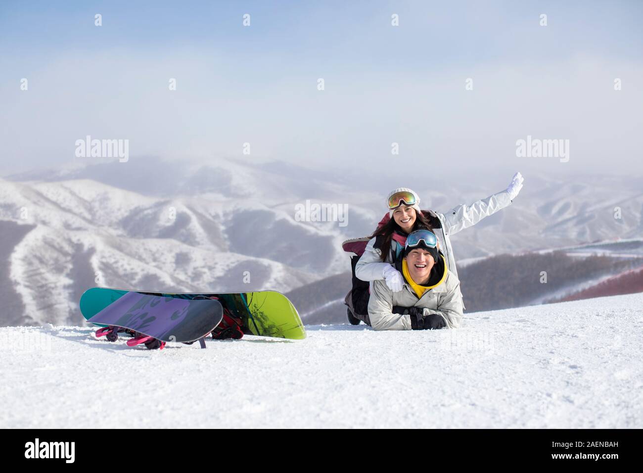 Happy young couple skiing in ski resort Stock Photo