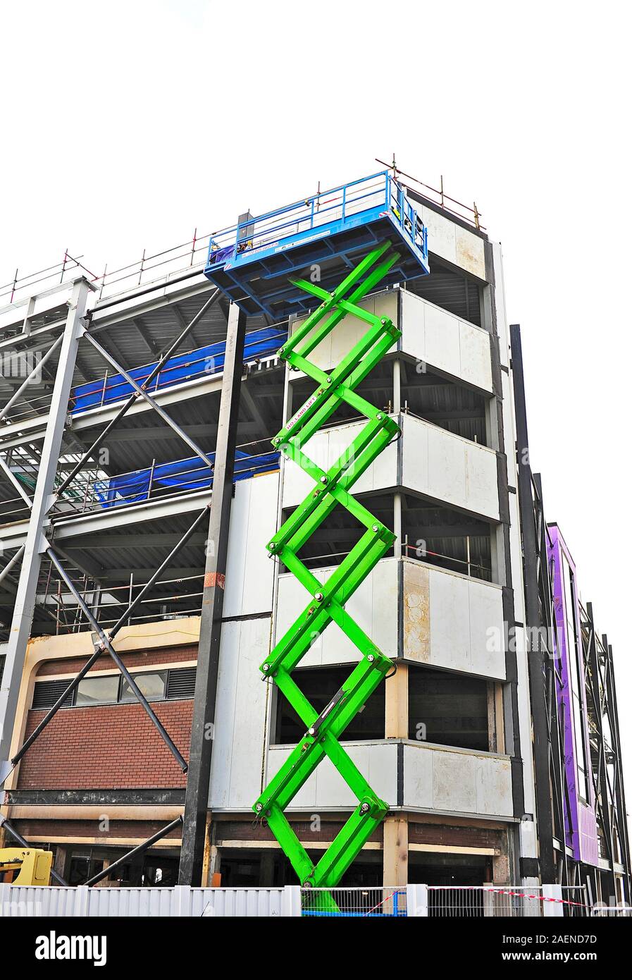 Scissor lift aerial platform at construction site Stock Photo