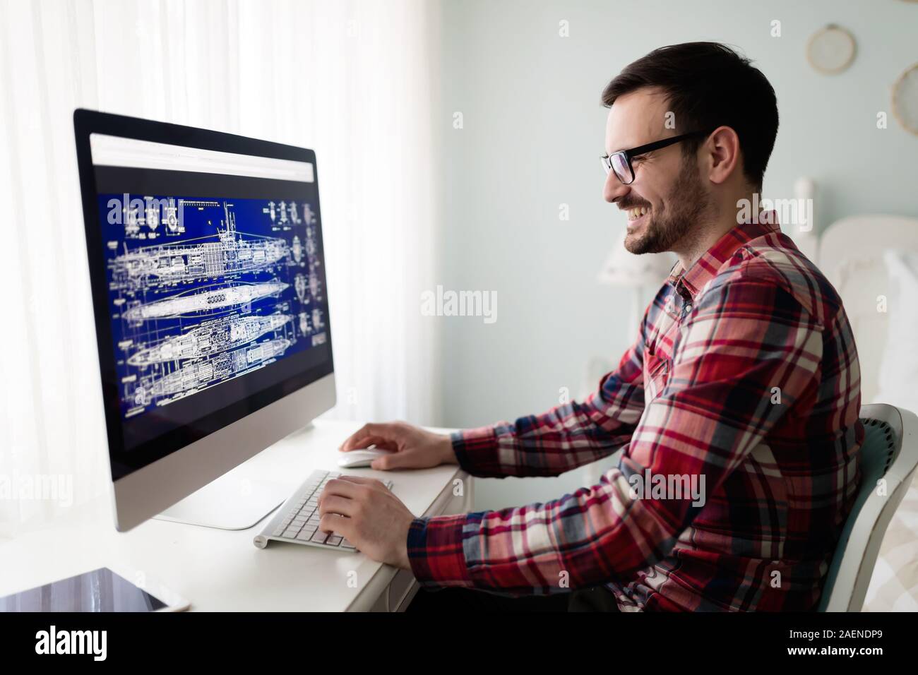 Young guy working table hi-res stock photography and images - Alamy