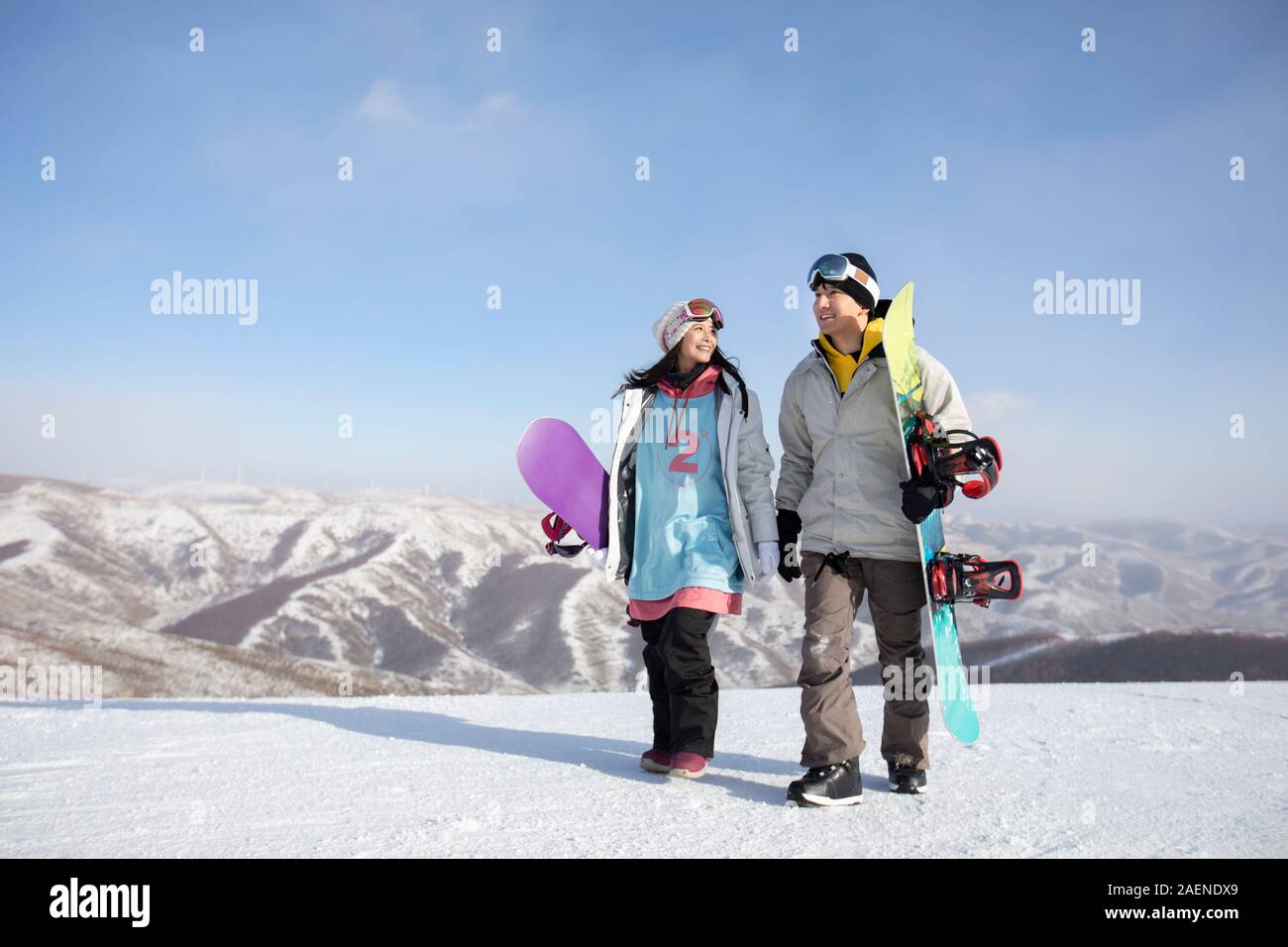 Young couple walking in ski resort Stock Photo