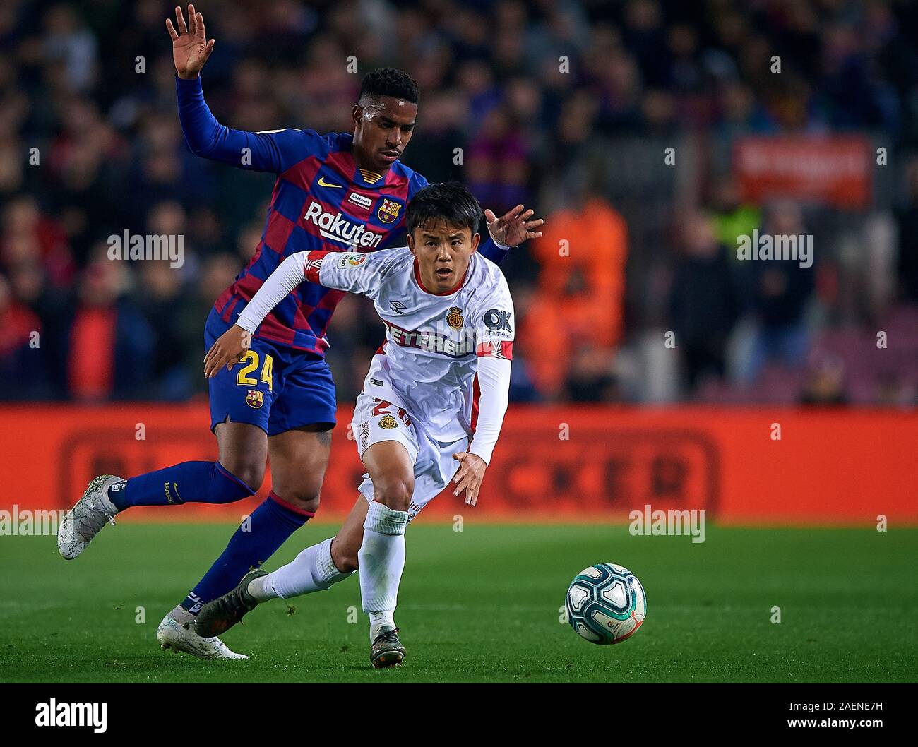 Barcelona, Spain. 07th Dec, 2019. Junior Firpo (L) of Barcelona competes for the ball with Takefusa Kubo of Mallorca during the Spanish Primera Division 'Liga Santander (Espanola)' Match between FC Barcelona vs RCD Mallorca at Camp Nou Stadium in Barcelona, Spain, December 07, 2019. Credit: Pablo Morano/ AFLO/Alamy Live News Stock Photo