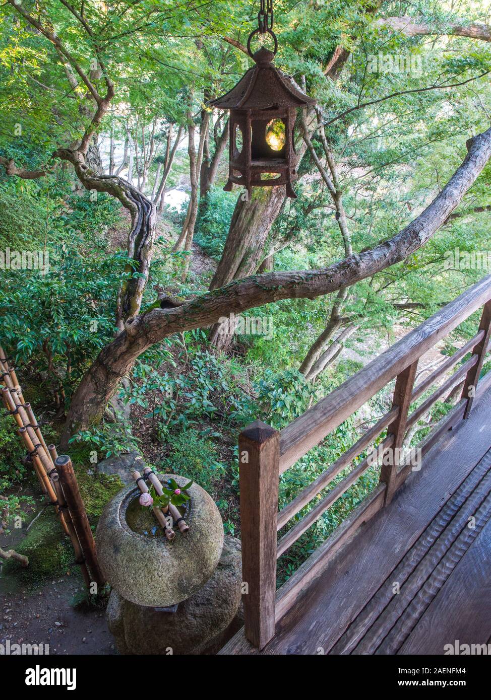 Japanese garden design - iron lantern, stone water basin, wooden verandah, Furoan hermitage, Garyusanso, Ozu, Ehime, Shikoku Japan Stock Photo