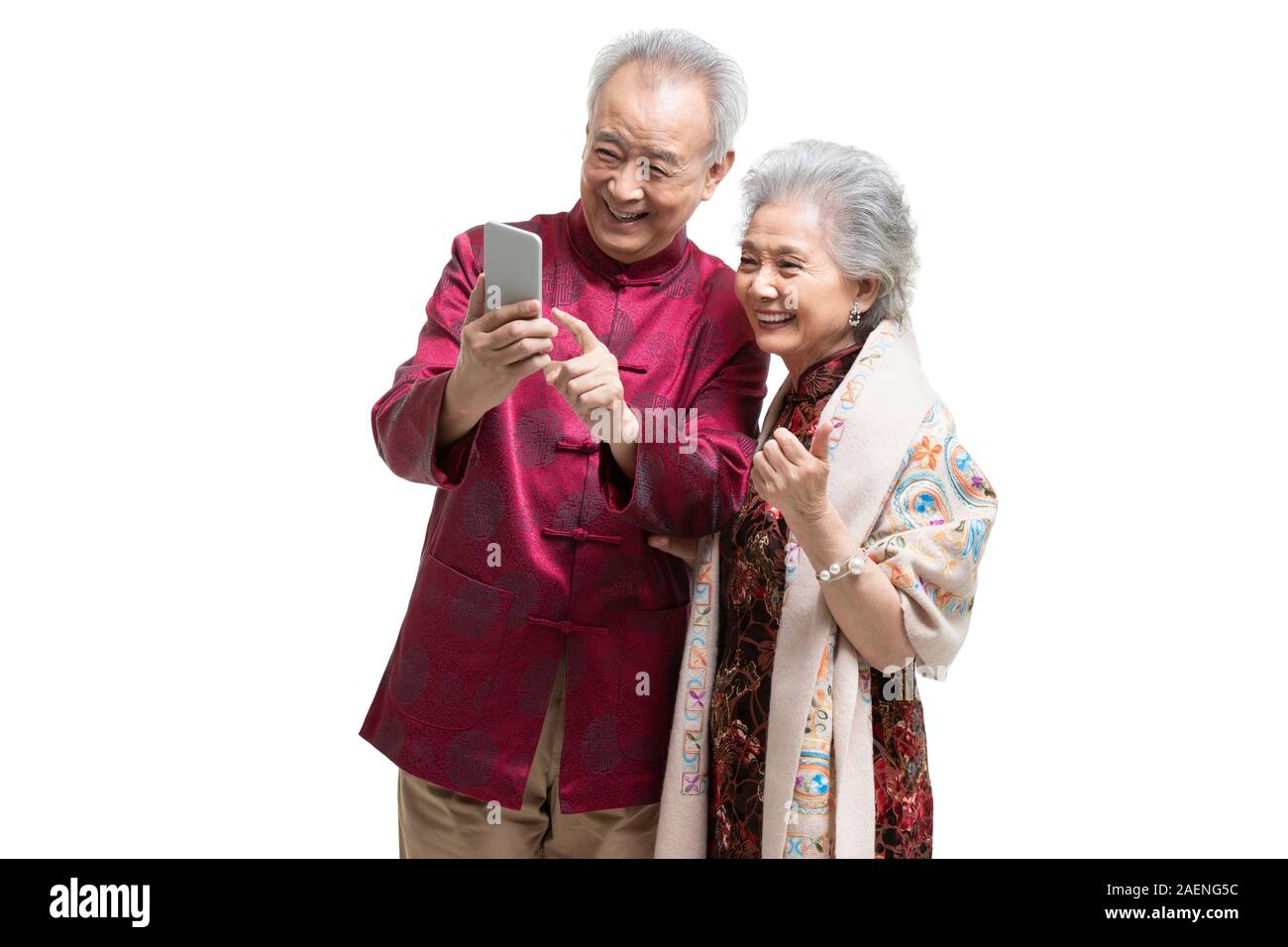 Happy senior couple using smartphone Stock Photo